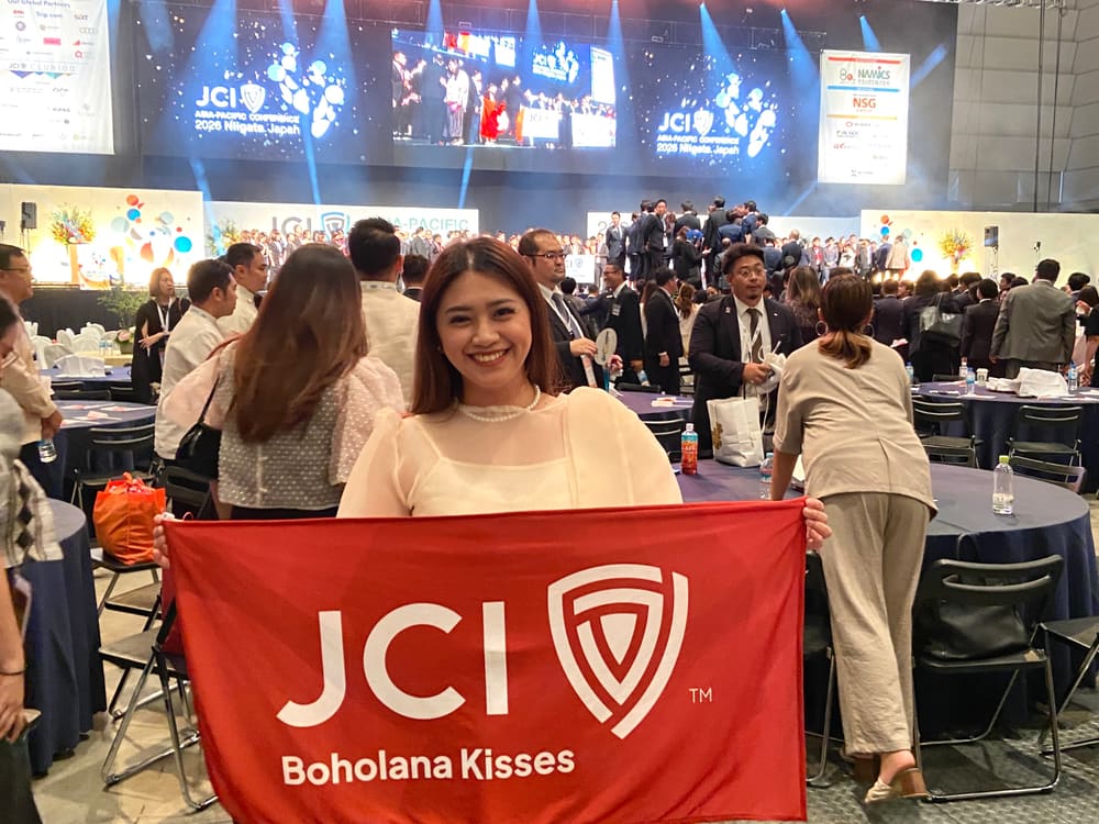 Delegates gathered with a chapter flag