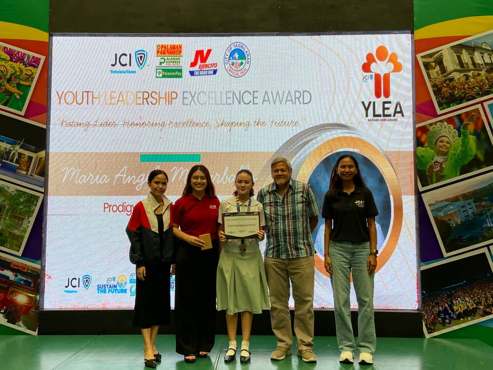 An awardee receiving recognition on stage